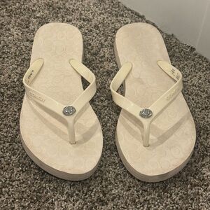 Coach Creamy White Sandals with Thong Design & Silver emblem